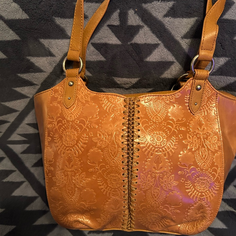 The SAK brand Bolinas Satchel 
Leather - Tobacco Floral Emboss